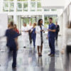 doctor in a busy hospital lobby