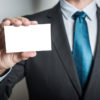 man holding blank card