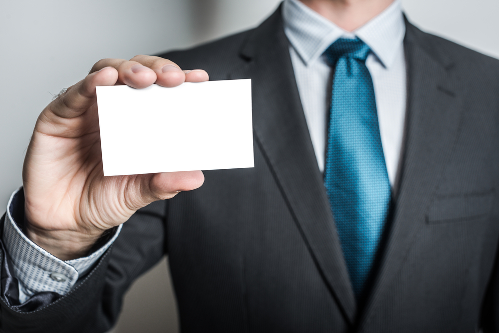 man holding blank card